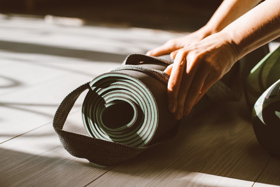 Close-up of mats lined up before a flow class